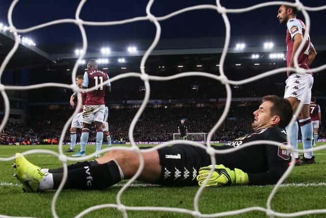 Aston Villa goalkeeper Tom Heaton shows his dejection after Sadio Mane's late, late winner for Liverpool on Saturday