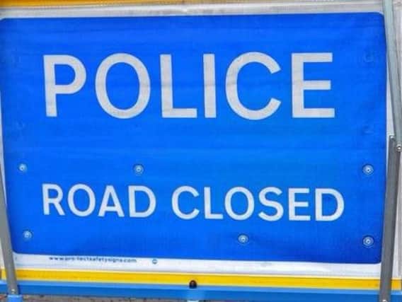 A busy road in Northampton is closed this afternoon following a two-vehicle collision.
