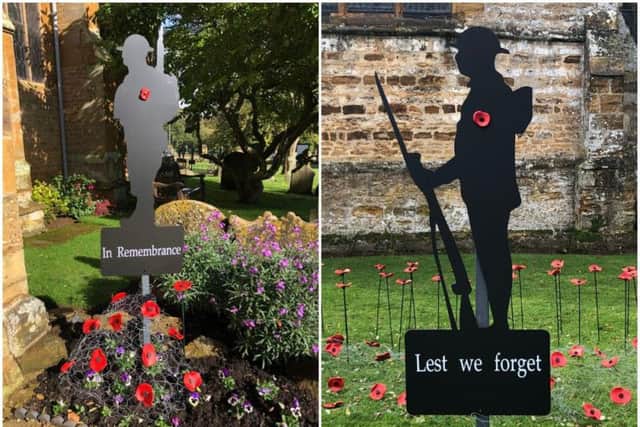Soldier silhouettes surrounding with poppies at St Peter and St Paul's Church, Abington