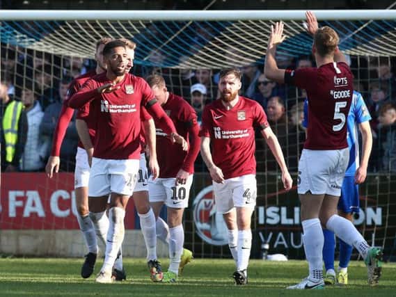 Vadaine Oliver takes the plaudits after scoring his first goal for the Cobblers, heading home Nicky Adams' cross 25 minutes into Sunday's tie. Pictures: Pete Norton