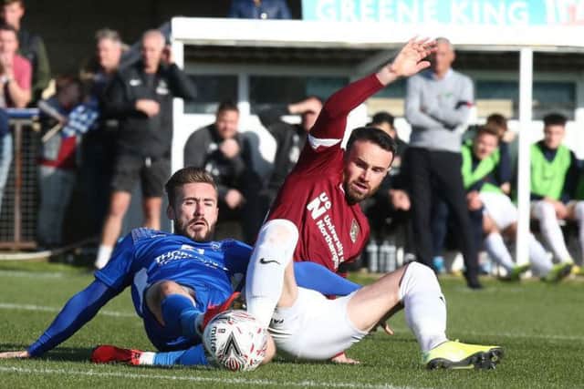 Matty Warburton tangles for the ball