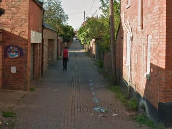 A six-foot red brick wall in a Northampton neighbourhood collapsed outwards into an alleyway.