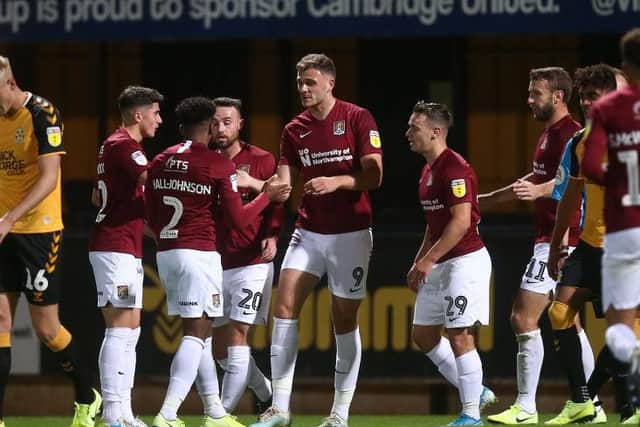 Cobblers confirmed their place in the next round after beating Cambridge United.