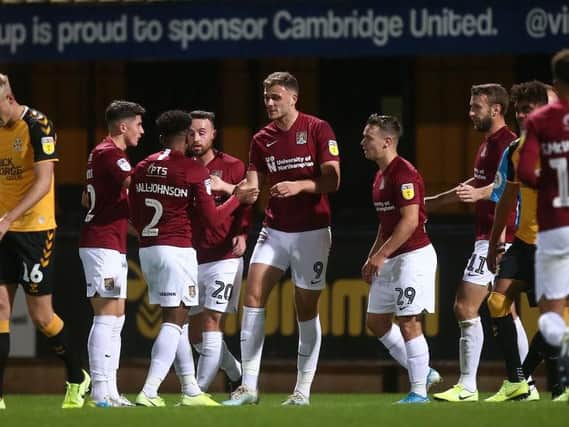 Cobblers confirmed their place in the next round after beating Cambridge United.
