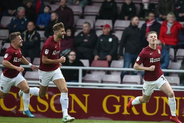 Scott Wharton celebrates his first goal for the Cobblers, one of two in the first-half against Crewe. Picture: Pete Norton