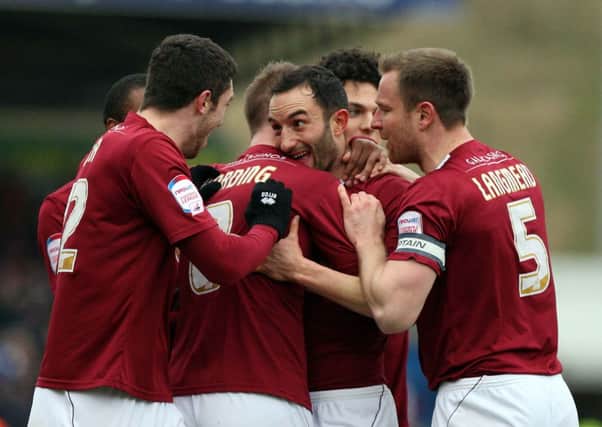 ON A ROLL - Chris Hackett celebrates his goal in the win over Accrington (Picture: Kelly Cooper)