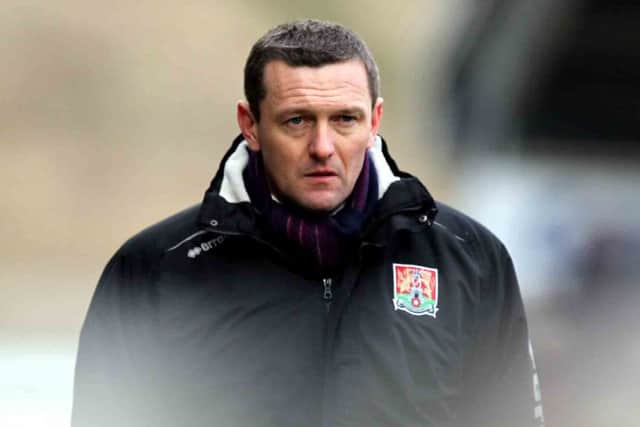 ALL CHANGE - Cobblers boss Aidy Boothroyd will tinker with his tactics for the trip to Morecambe on Tuesday night