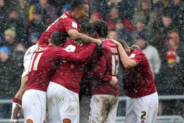 BIG MOMENT - Cobblers players celebrate Ben Harding's goal that saw off Oxford United at Sixfields (Picture: Sharon Lucey)