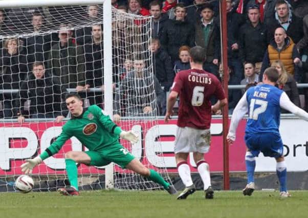 THAT'S THAT - York's Matt Blair puts in the cross which was diverted into his own net by Cobblers defender John Johnson to make it 2-0 at Sixfields (Picture: Sharon Lucey)