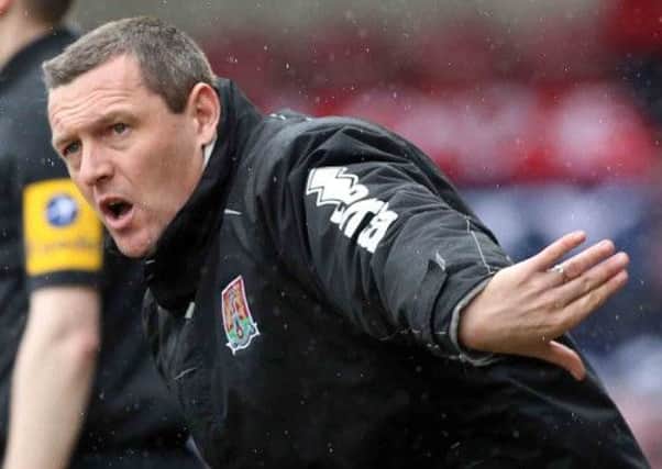 KEEPING COOL - Cobblers boss Aidy Boothroyd won't make drastic changes for the trip to Wycombe
