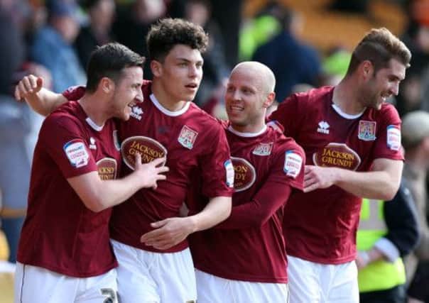 ATTACKING THREAT - the Cobblers celebrate Roy O'Donovan's goal at Port Vale (Picture: Kelly Cooper)