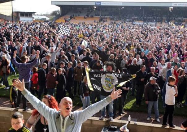 LOUD AND PROUD - the Port Vale fans enjoy their promotion last weekend, following the 2-2 draw with the Cobblers at Vale Park (Picture: Kelly Cooper)