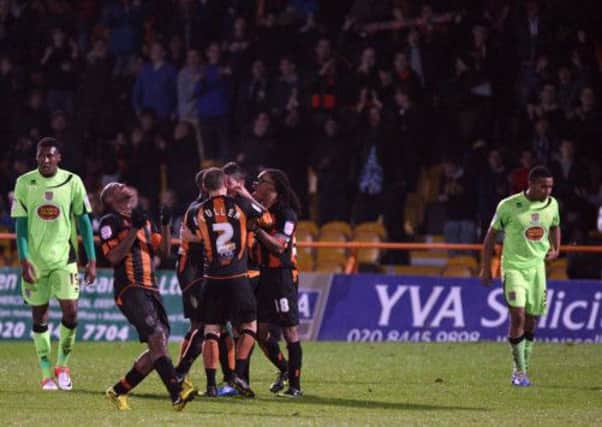 BITTER MEMORY - Barnet's players celebrate one of their goals in the 4-0 demolition of the Cobblers at Underhill earlier this season