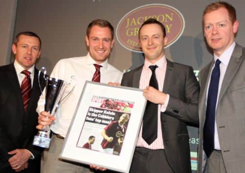 KING KELVIN - Cobblers skipper Kelvin Langmead accpets his player of the year award from Chronicle & Echo football writer Jefferson Lake, with manager Aidy Boothroyd (left) and David Lewis (right) of award sponsors Jackson Grundy looking on