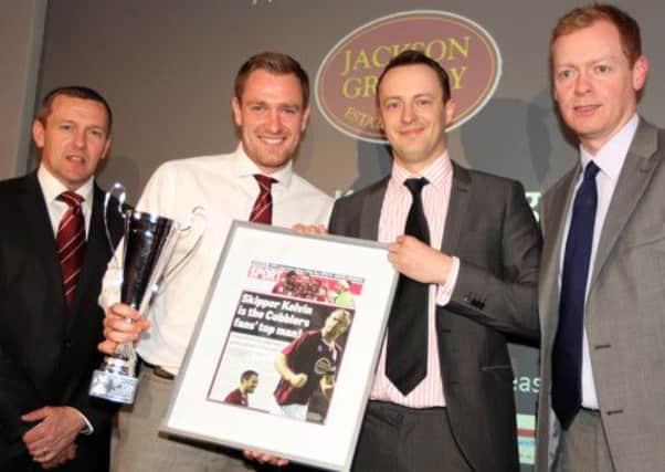 KING KELVIN - Cobblers skipper Kelvin Langmead accpets his player of the year award from Chronicle & Echo football writer Jefferson Lake, with manager Aidy Boothroyd (left) and David Lewis (right) of award sponsors Jackson Grundy looking on