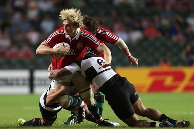 Barbarians' Samu Manoa (right) tackles British and Irish Lions' Richie Gray