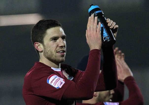 SIGNING ON - Ben Tozer has put pen to paper on a new two-year deal at the Cobblers