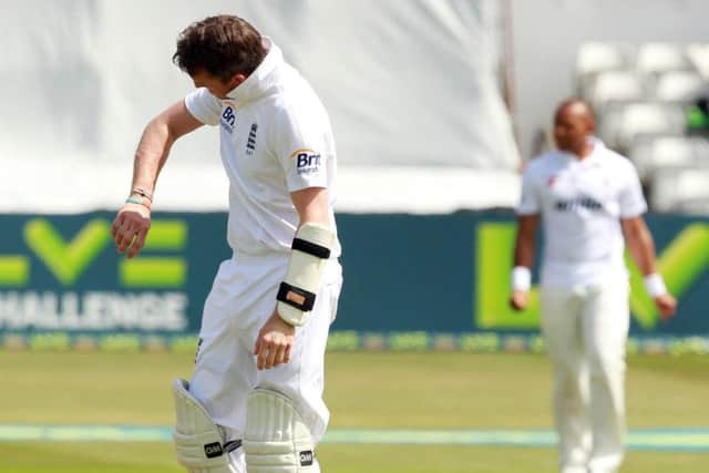 THAT HURT - Graeme Swann inspects the damage after he was hit on the arm by Essex fast bowler Tymal Mills