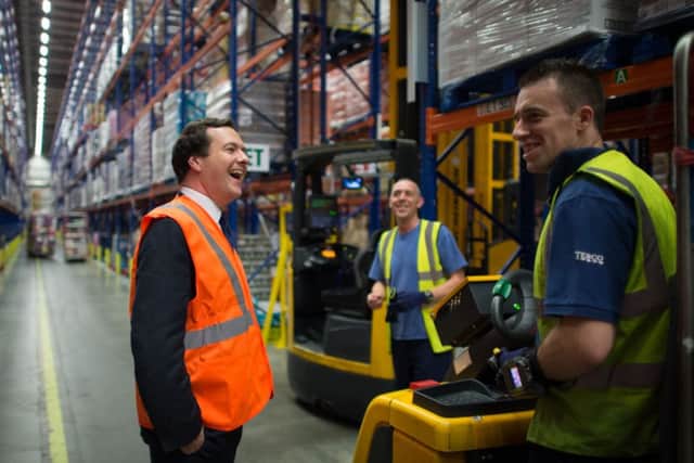 Chancellor of the Exchequer George Osborne meets staff at Tesco's National Distribution Centre near Daventry. Picture: Stefan Rousseau/PA Wire