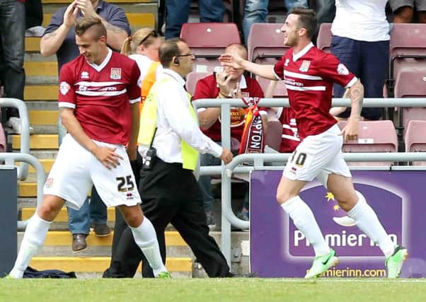 DREAM DEBUT - Jacob Blyth (left) celebrates after putting the Cobblers 1-0 ahead against Newport County (pictures: Kirsty Edmonds)