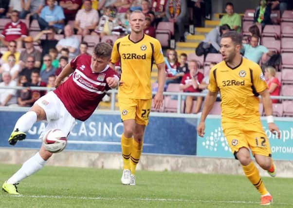 THAT SETTLES IT - Gary Deegan volleys home the Cobblers' third goal against Newport at Sixfields (pictures: Kirsty Edmonds)