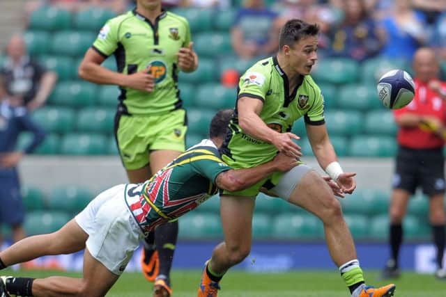 Northampton's Tom Collins offloads during the World Club Sevens against San Francisco at Twickenham