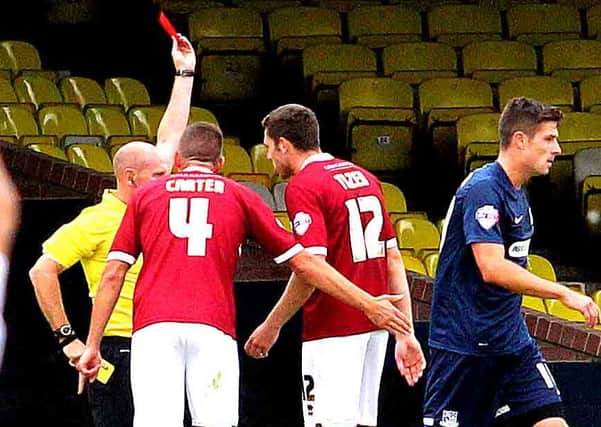 HE'S OFF - Darren Carter and Ben Tozer appeal to the referee as Chris Hackett is shown the red card