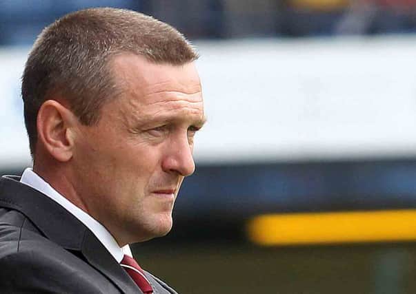 NOT HAPPY - Aidy Boothroyd watches his Cobblers team lose at Southend on Saturday (Picture: Sharon Lucey)