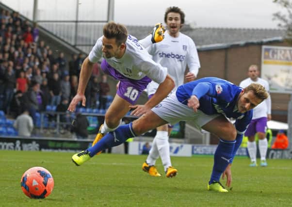 THAT'S A FOUL - Daventry striker Tom Lorraine is upended by Chesterfield's Liam Cooper