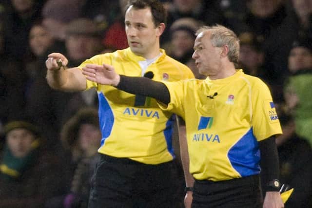 TAKING HIS TIME - referee Greg Garner (left) frustrated both bosses with his use of the TMO (Picture: Linda Dawson)