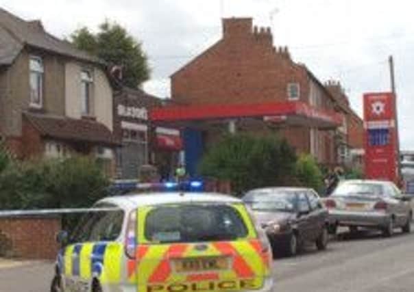A man climbed onto the roof of a petrol station after a police chase in Brixworth