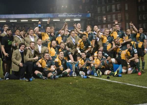 SQUAD EFFORT - the Saints team and squad players celebrate their success at the Cardiff Arms Park (Pictures: Lidna Dawson)