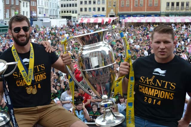 LEADING LIGHTS - Tom Wood (left) and Dylan Hartley show off the Aviva Premiership trophy during last Sunday's victory parade through Northampton