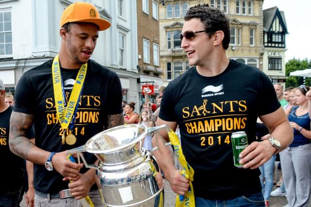 HAPPY MAN - Courtney Lawes (left) and Phil Dowson enjoy the Saints victory parade in Northampton last weekend