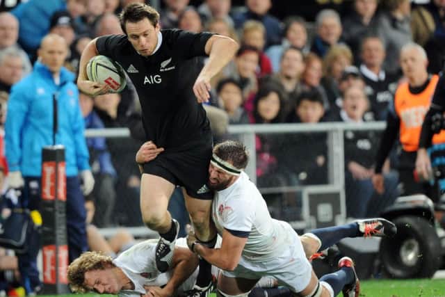 DOUBLING UP - New Zealands Ben Smith is tackled by Englands Billy Twelvetrees (left) and Saints flanker Tom Wood in the second at Forsyth Barr Stadium  (AP Photo/SNPA, Ross Setford)