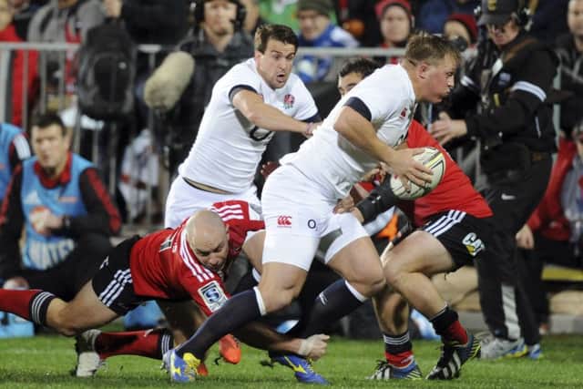 ON THE CHARGE - Englands Alex Waller slips a tackle of Crusaders Willi Heinz, with Lee Dickson in support