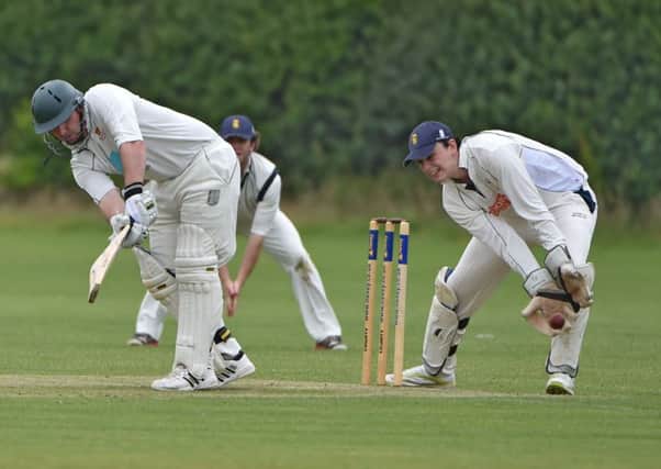 HITTING OUT - Rob White clips a boundary on his way to a century for ONs against Burton Latimer (Pictures: Dave Ikin)