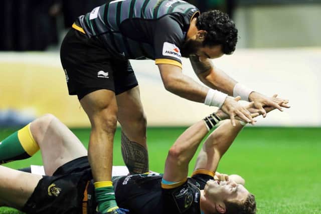PERFECT 10 - Kahn Fotuali'i congratulates Saints' star man George North on his stunning fourth try against Ospreys (Pictures: Kirsty Edmonds)