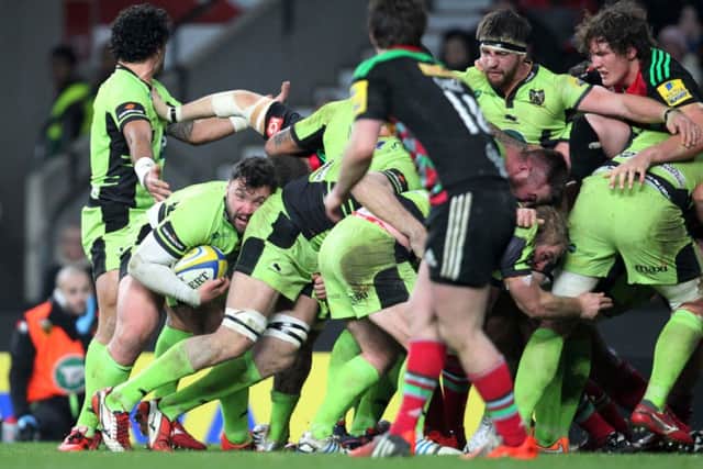 IN ACTION - Alex Corbisiero (second left) carries the fight against Harlequins (picture: Sharon Lucey)