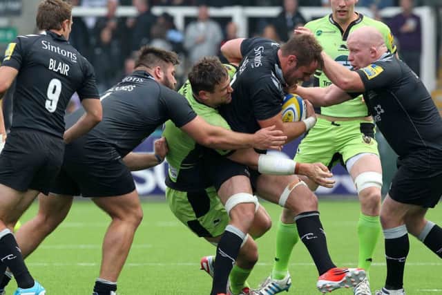 Kieran Brookes (second left) scraps it out against Saints during their Premiership clash last September