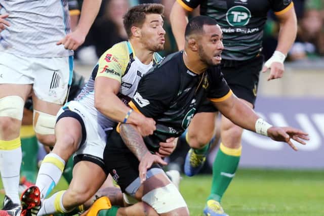 THREAT - Rhys Webb gets to grips with Samu Manoa in Ospreys' defeat to Saints last year