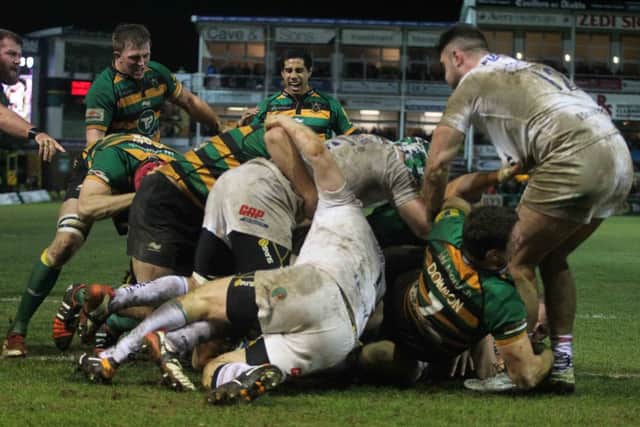 TOUGH BATTLE - Alex Waller (left) looks on as Sam Dickinson scores his try for Saints in Friday's win over London Irish (Picture: Sharon Lucey)