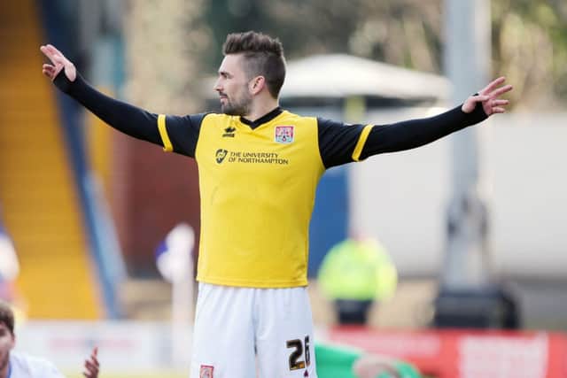 HIGH POINT - Ricky Holmes celebrates scoring for the Cobblers at Bury (Picture: Kirsty Edmonds)