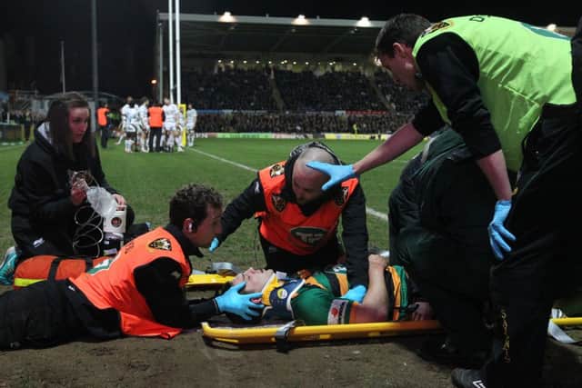 WORRYING MOMENT - George North is treated by the Saints medical staff after he was knocked out while scoring his team's second try against Wasps (Pictures: Sharon Lucey)