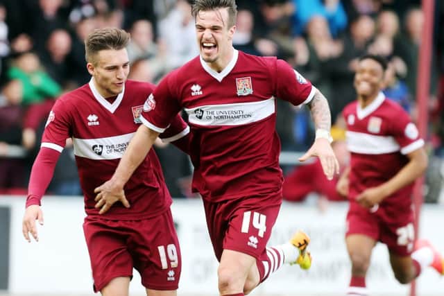 James Gray celebrates after scoring the Cobblers' winner against Luton (pictures: Kirsty Edmonds)