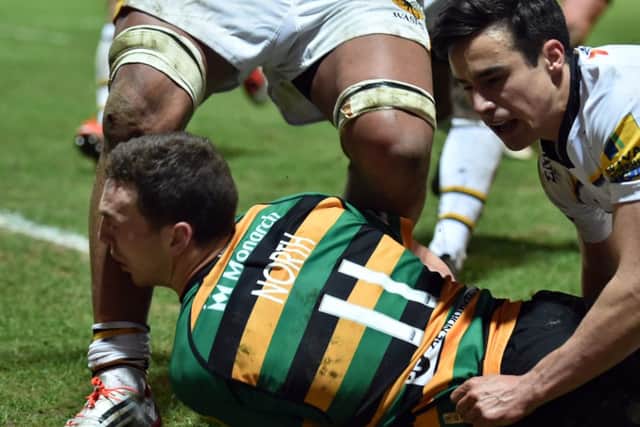 MOMENT OF IMPACT - George North collides with the knee of Wasps' Nathan Hughes at Franklin's Gardens on Friday night (Picture: Dave Ikin)