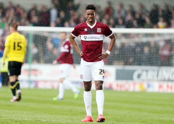 PAIN IN THE RAIN - Ivan Toney and his Cobblers team-mates really struggled in the first half at Burton on Saturday (Pictures: Kirsty Edmonds)
