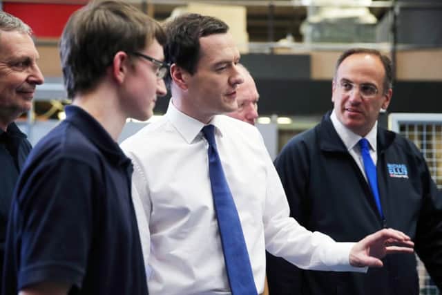 George Osborne meets staff on the factory floor in Moulton.