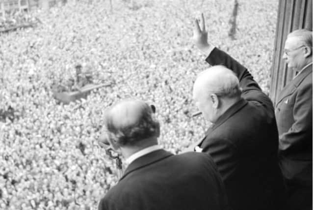 Winston Churchill waves to the crowds on VE Day. Picture: Imperial War Museum