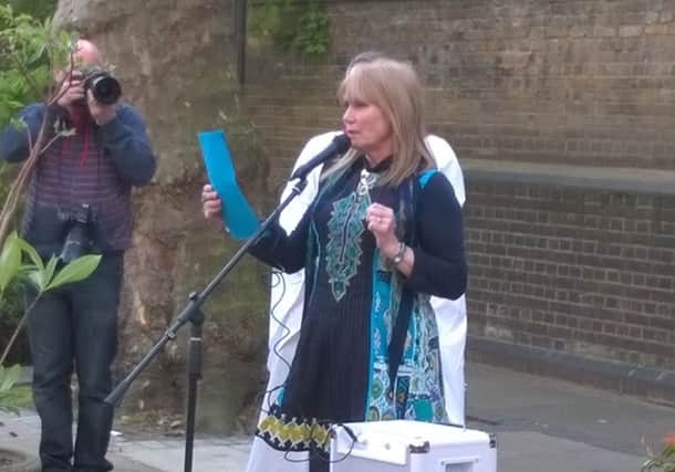 Terry Morley giving her reading at the memorial event